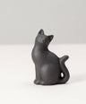 paperweight long-tailed cat 