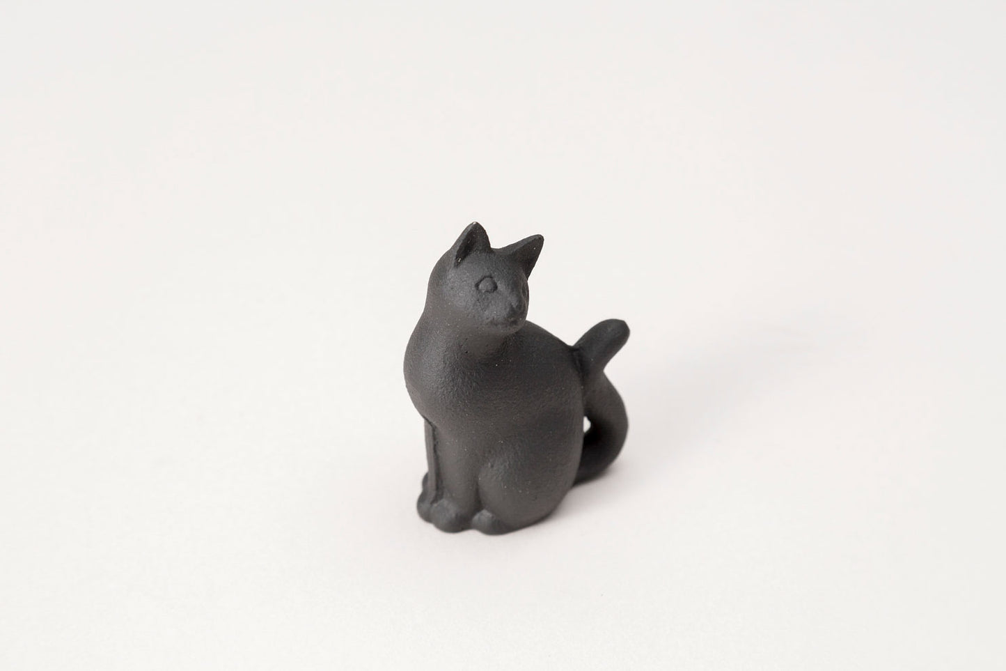 paperweight long-tailed cat 