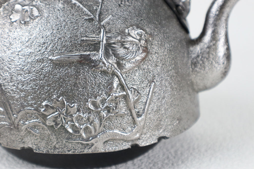 Iron kettle with cherry blossoms and small birds emblem